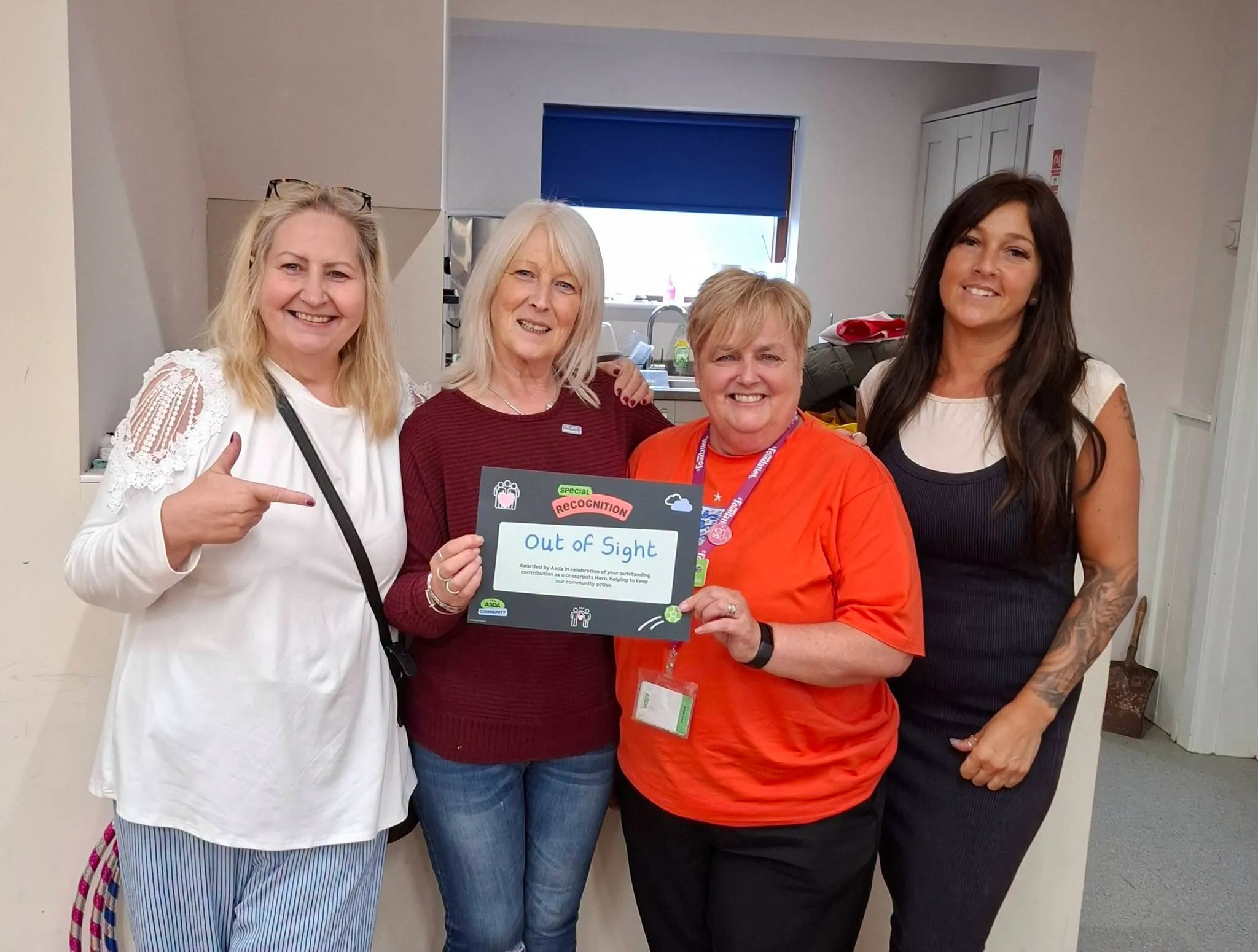 The Out of Sight organisers receive the charity's special recognition certificate